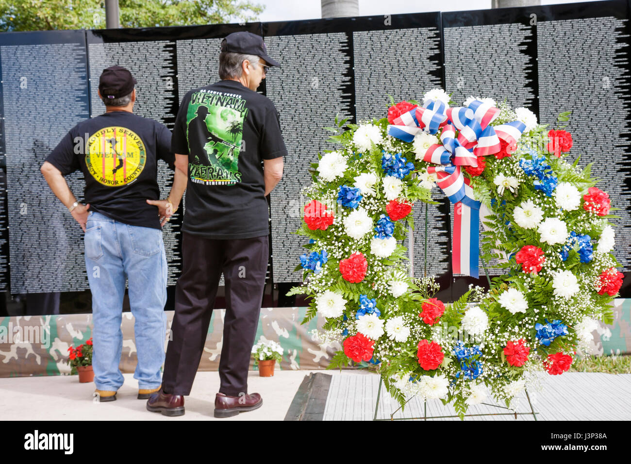 Miami Florida,Bayfront Park,The Moving Wall,Vietnam Veterans Memorial,replica,names,killed in action,opening ceremony,military,war,man men male,wreath Stock Photo
