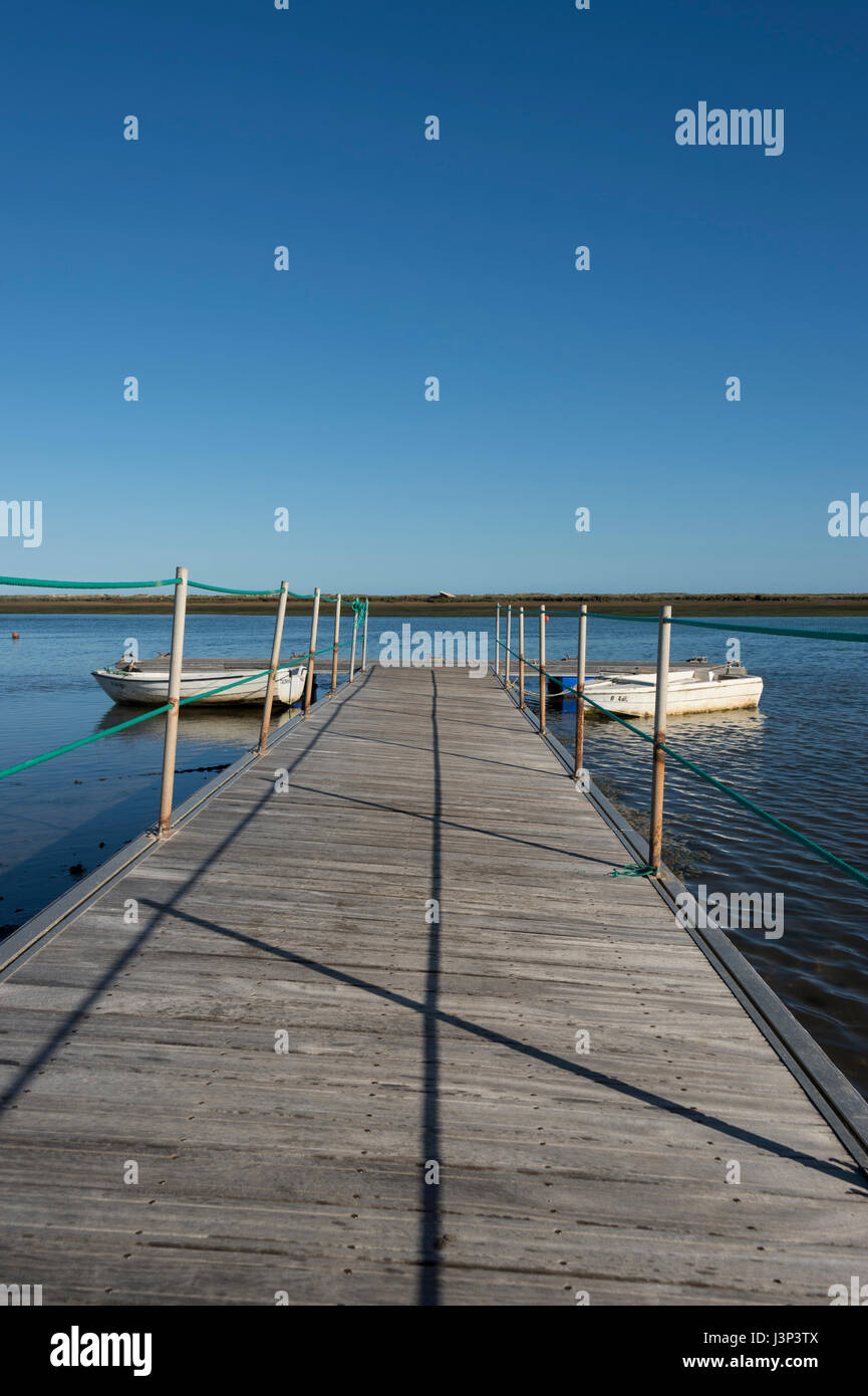 wooden jetty on the  Ria Formosa Natural Park, Portugal. Stock Photo