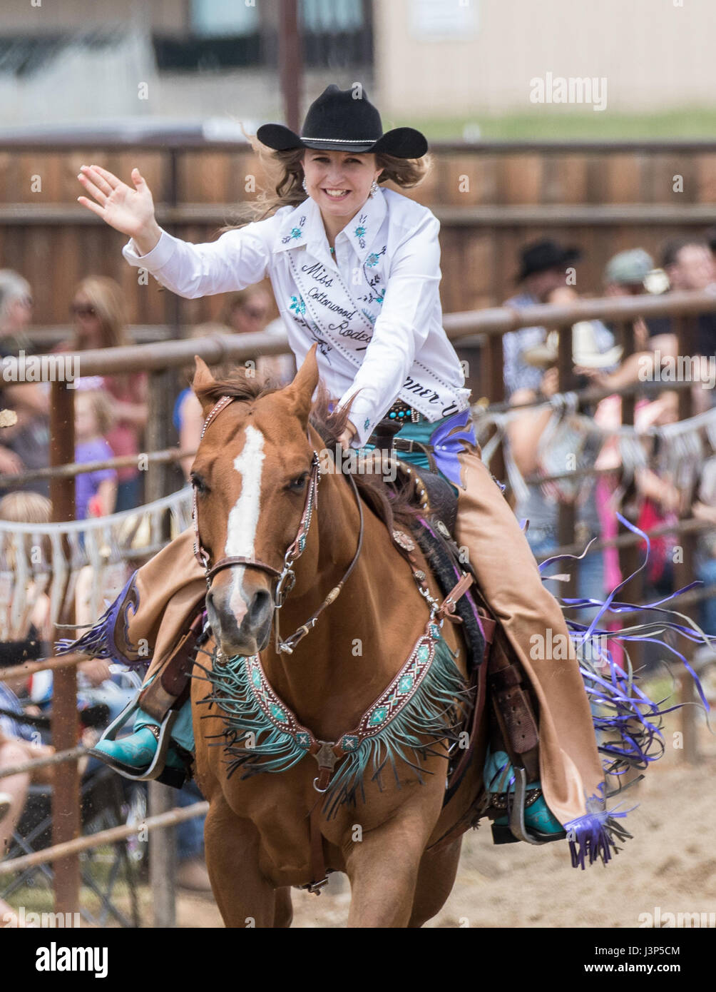 Rodeo cowgirls make an entrance at the Cottonwood Rodeo in northern