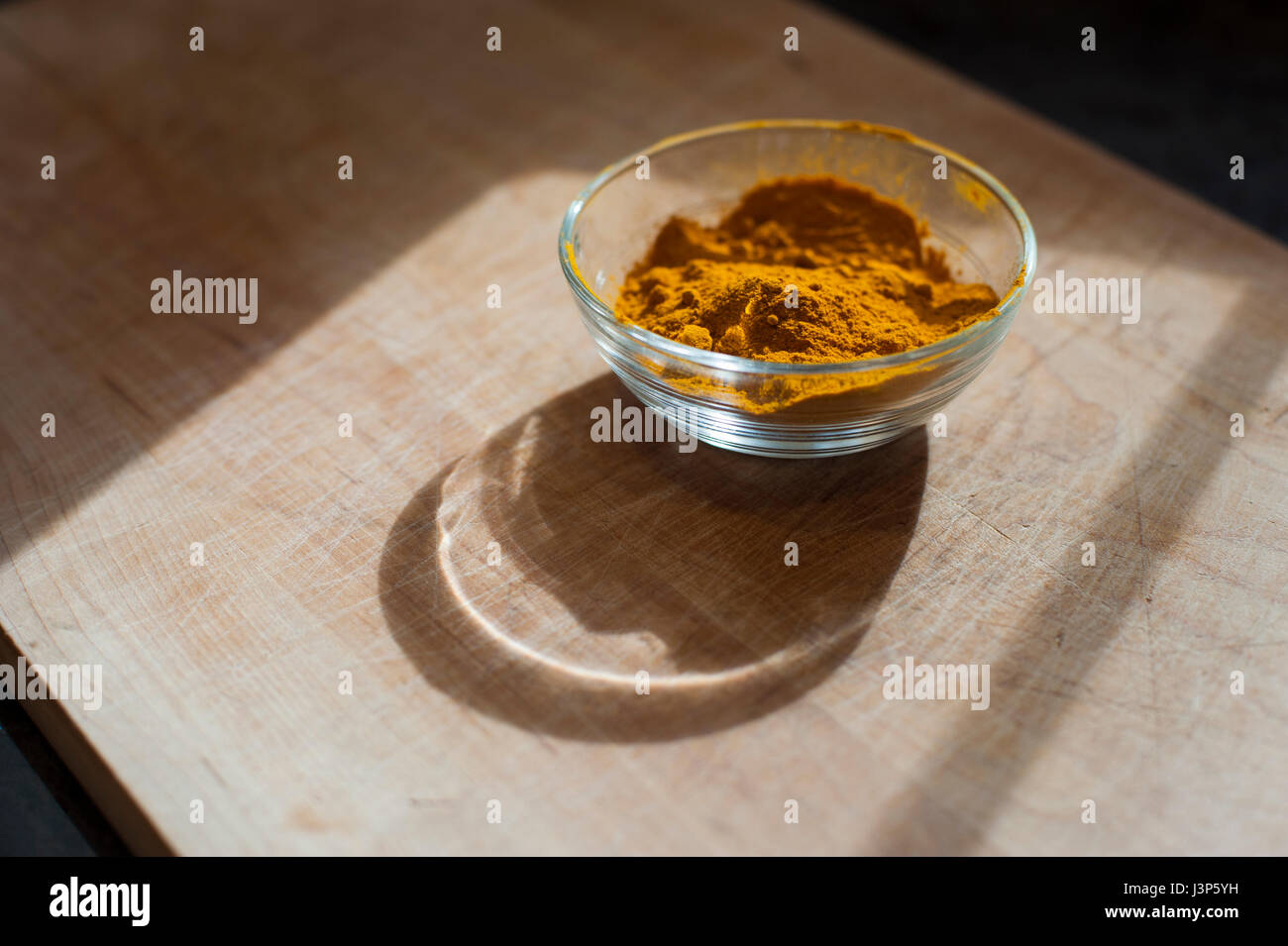 Turmeric Powder in a Glass Dish Stock Photo Alamy