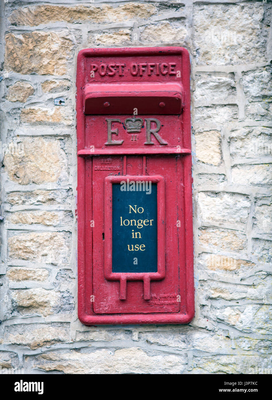 CASTLE COMBE, UK - MAY 5, 2017: Main street in Castle Combe, Wiltshire, UK,  showing old disused post office box Stock Photo