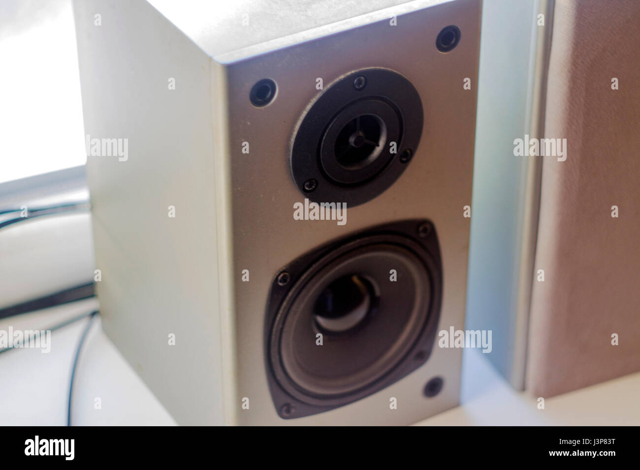Audio system. Two gray speakers made of wood Stock Photo