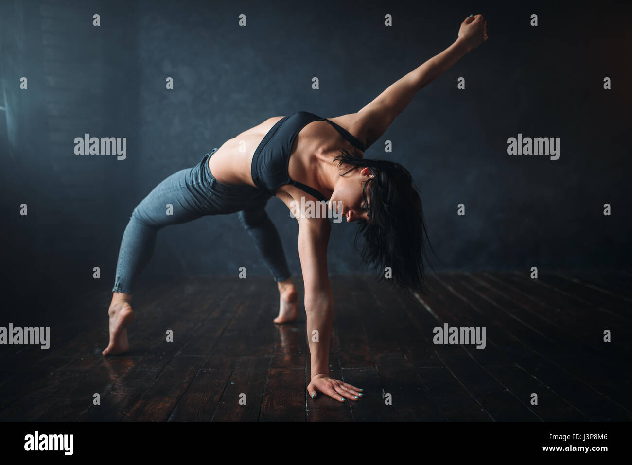 Contemp dancing female performer exercise in dance class. Woman pose in ...