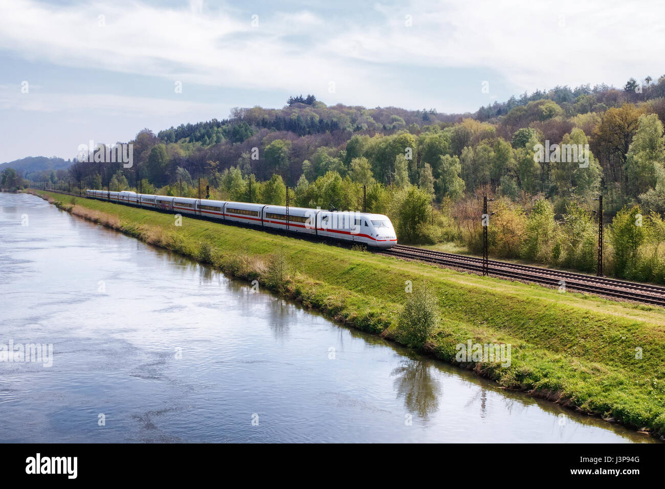 REISENSBURG, GERMANY - MAY 6, 2017: German high-speed train ICE (Intercity-Express) on the banks of the Danube river on May 6, 2017 in Reisensburg, Ge Stock Photo
