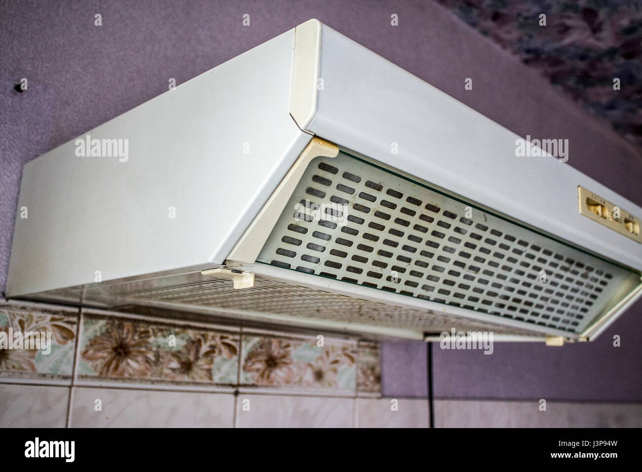 Old cooker hood in the kitchen with poor repair Stock Photo - Alamy