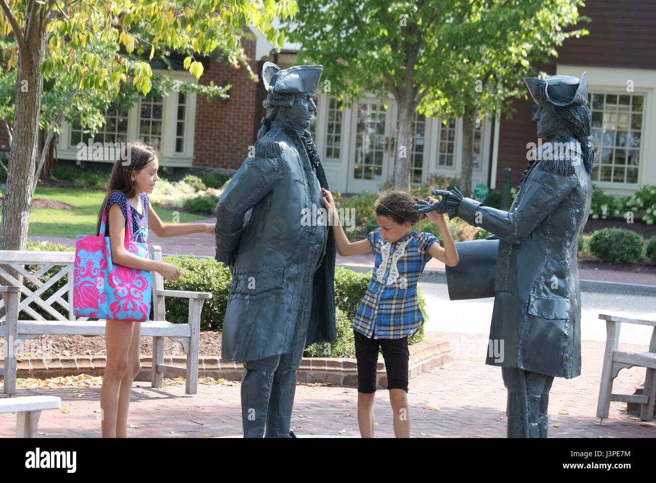 Children having fun around the statue of Washington and Francois