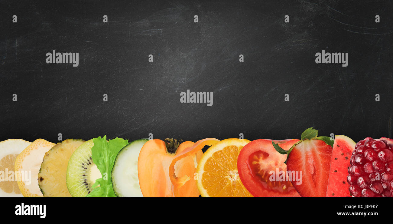 Colourful banner of fruits on blackboard background Stock Photo