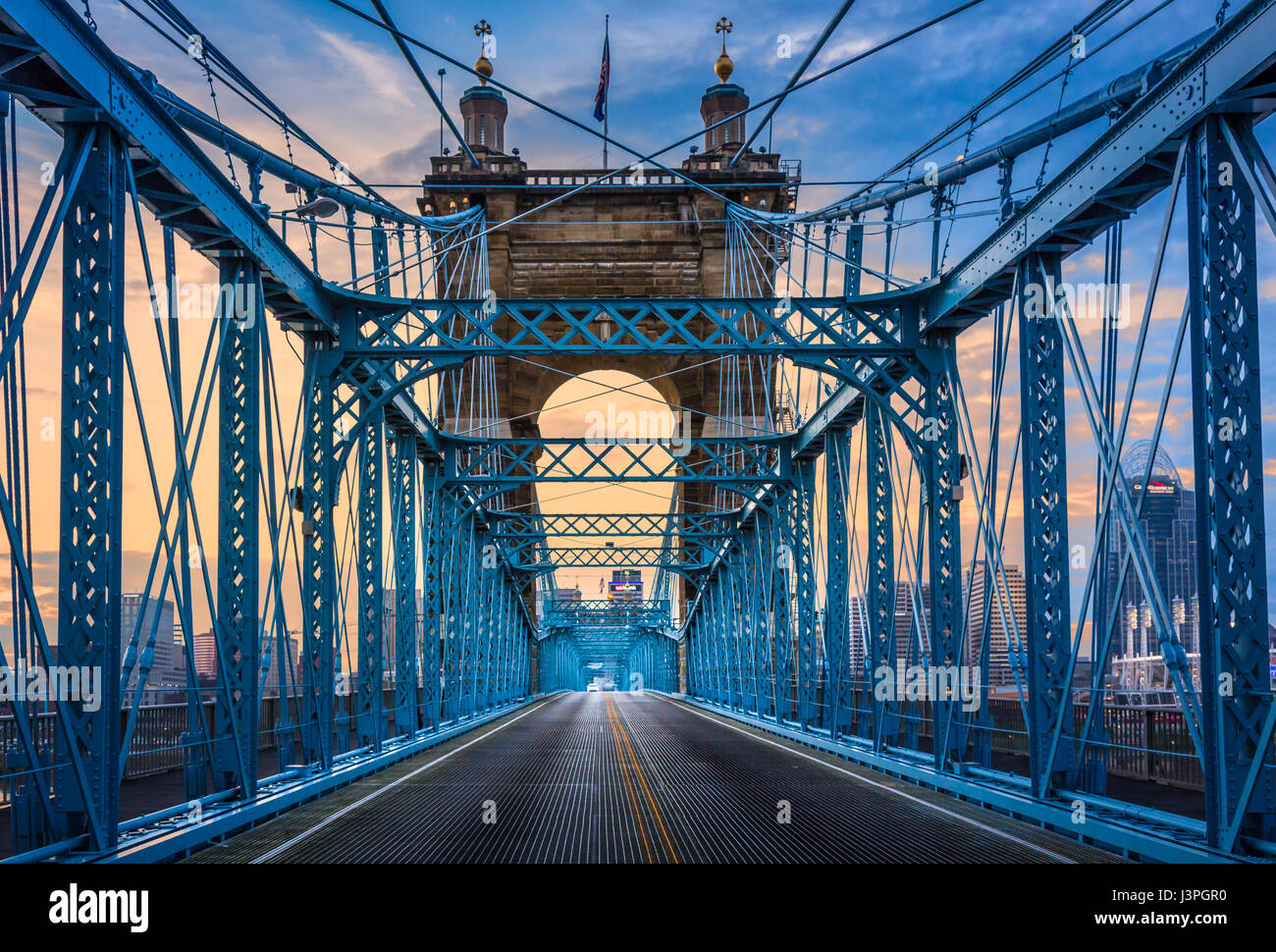 The John A. Roebling Suspension Bridge spans the Ohio River between Cincinnati, Ohio and Covington, Kentucky. When the first pedestrians crossed on De Stock Photo