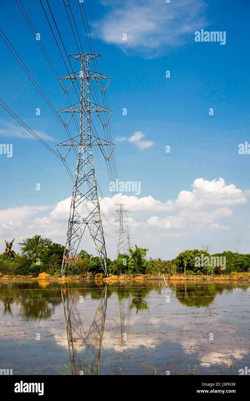 High voltage pole with blue sky and cloud on bright day Stock Photo - Alamy