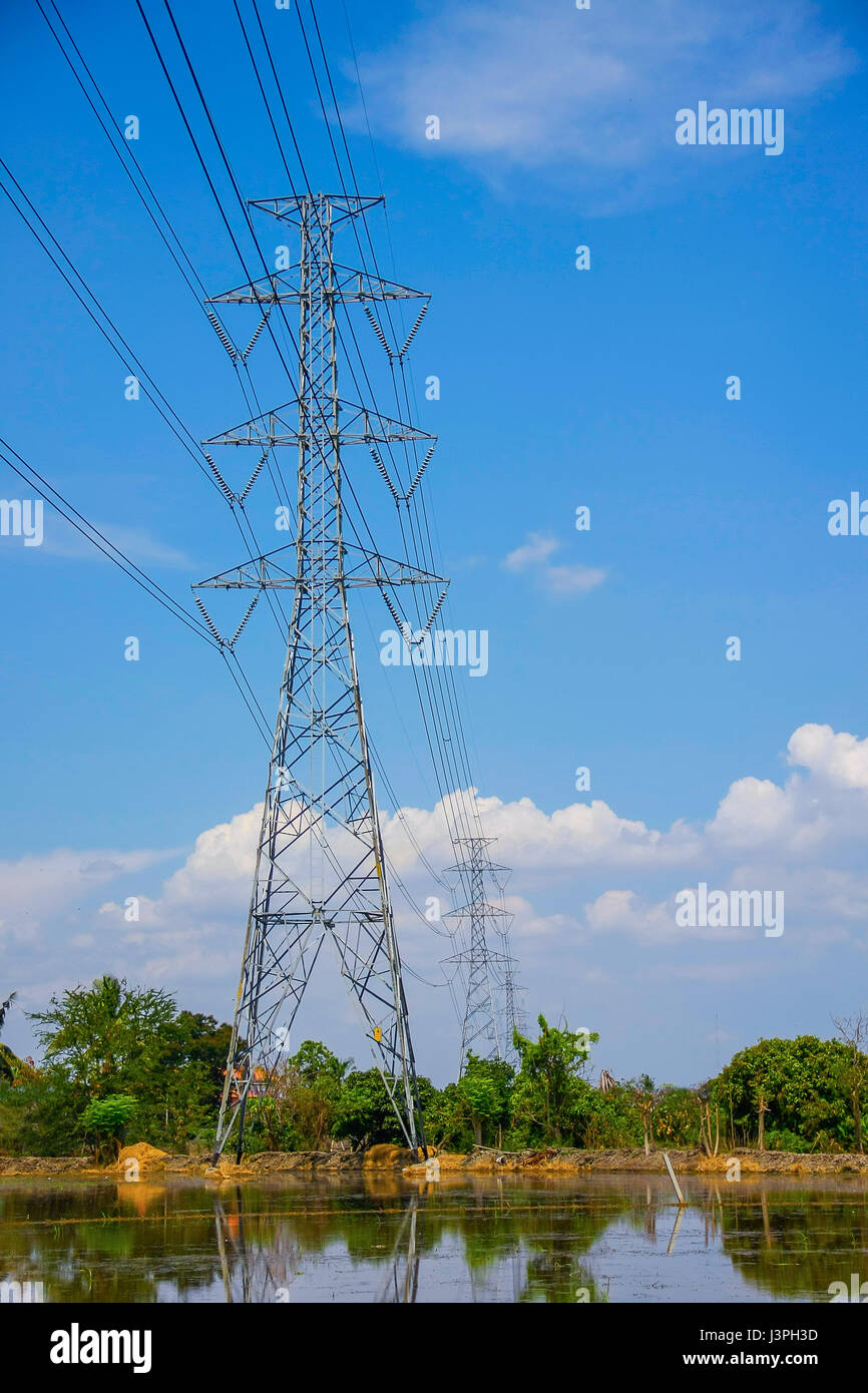 High voltage pole with blue sky and cloud on bright day Stock Photo - Alamy