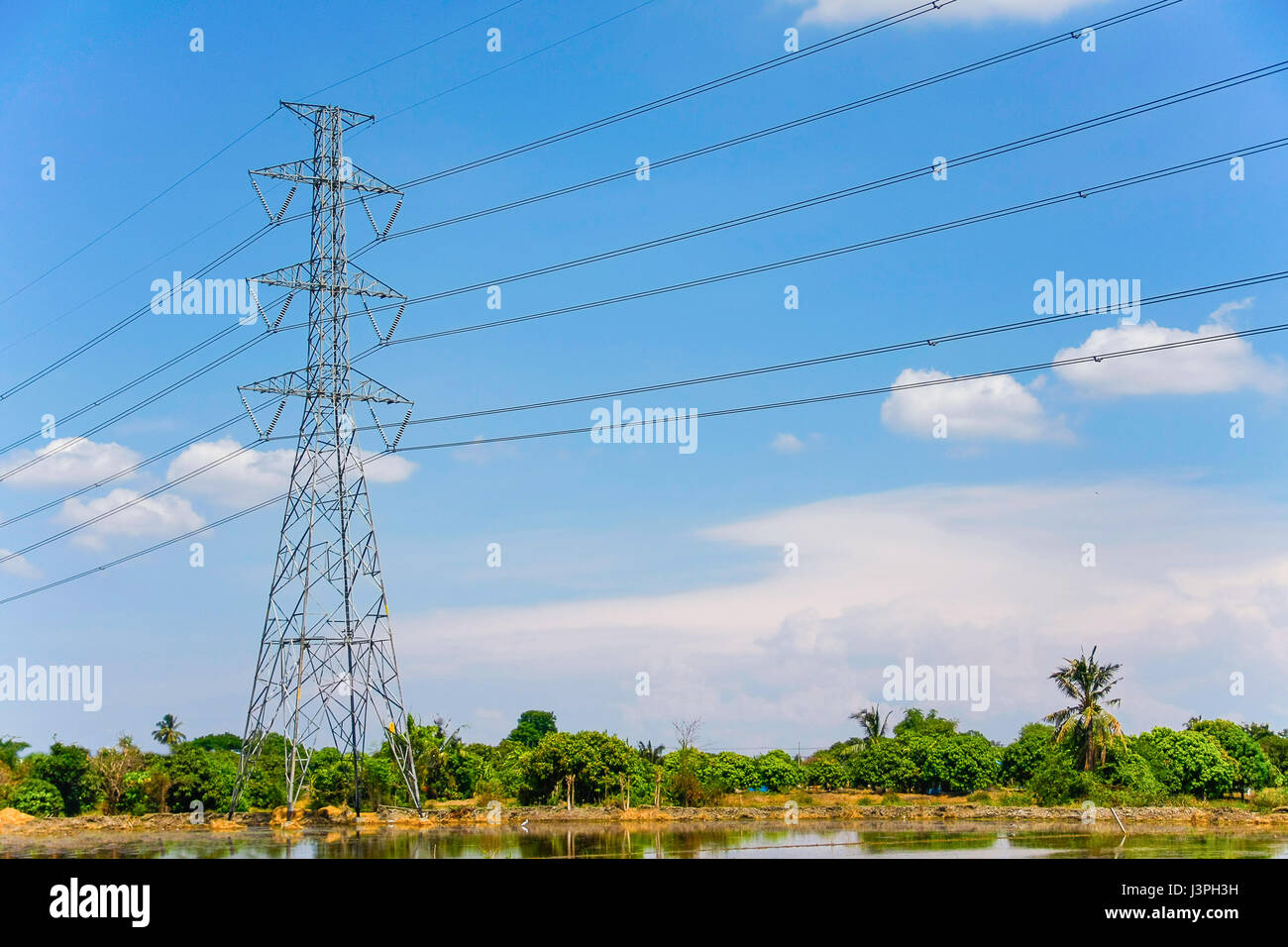 High voltage pole with blue sky and cloud on bright day Stock Photo - Alamy