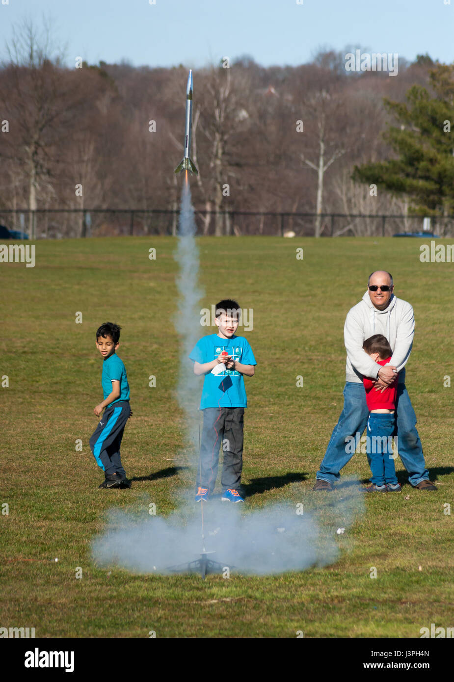 Boy launching a model rocket at Millennium Park, Boston Stock Photo Alamy