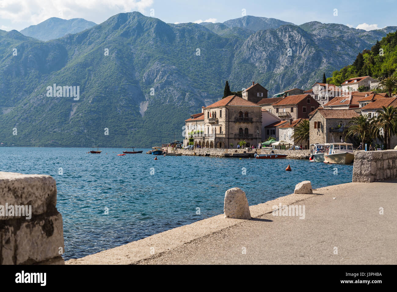 Perast is an old town on the Bay of Kotor in Montenegro. It is situated a few kilometres northwest of Kotor and is noted for its proximity to the isle Stock Photo