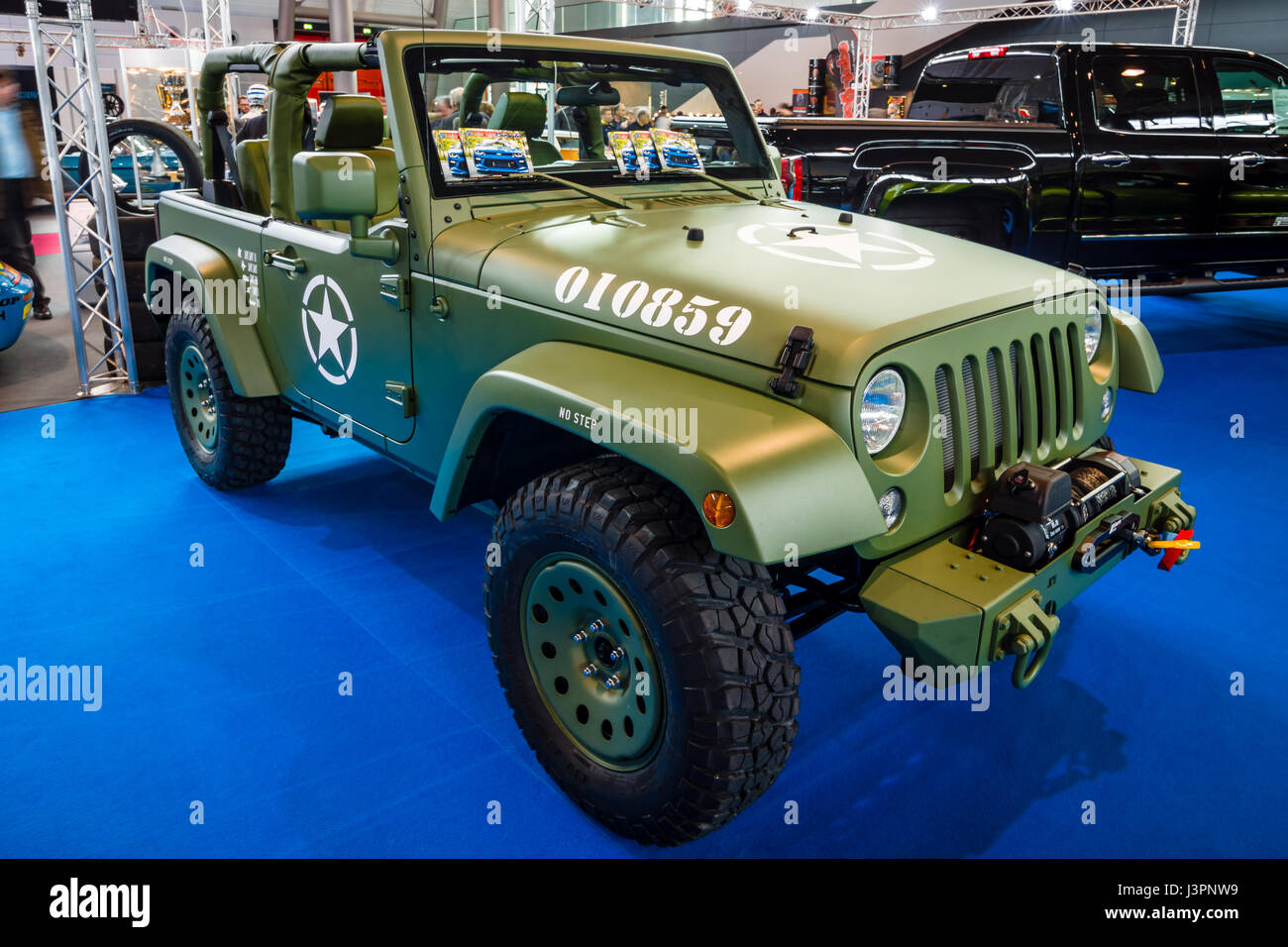 STUTTGART, GERMANY - MARCH 03, 2017: Compact SUV Jeep Wrangler (US Army  colored), 2017. Europe's greatest classic car exhibition 