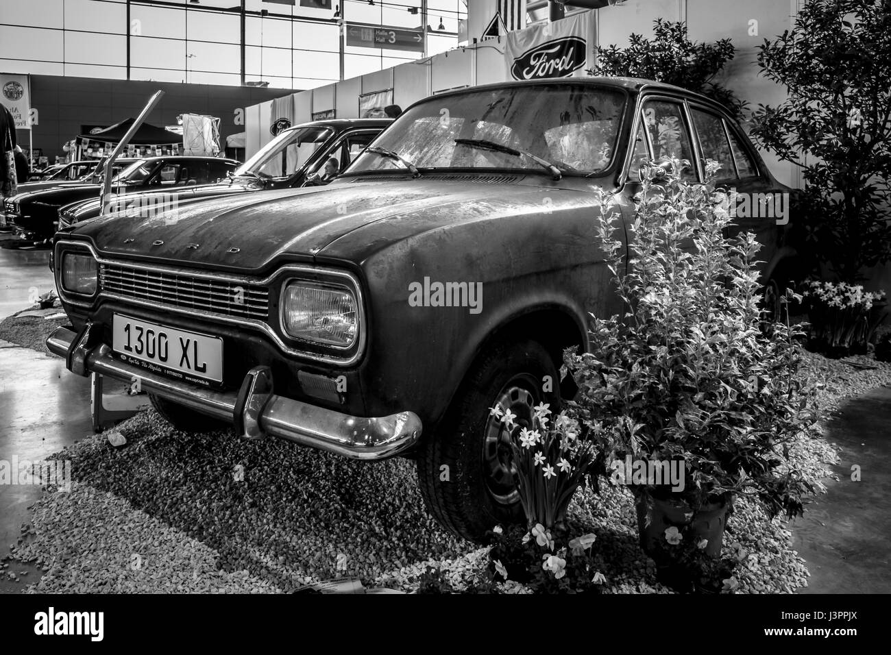 STUTTGART, GERMANY - MARCH 03, 2017: Small family car Ford Escort MK1 1300 XL, 1970. Black and white. Europe's greatest classic car exhibition 'RETRO CLASSICS' Stock Photo