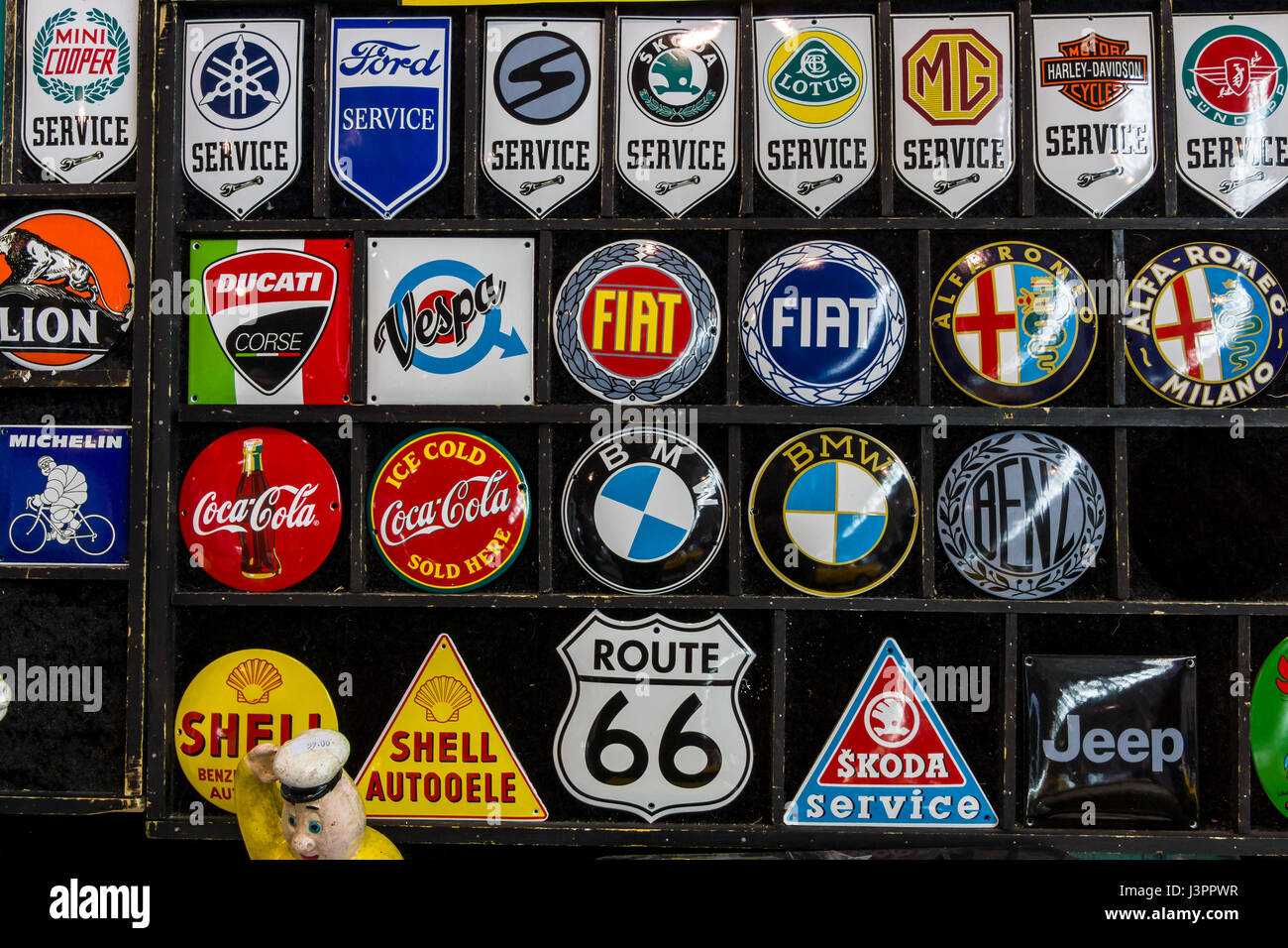 STUTTGART, GERMANY - MARCH 03, 2017: Souvenir magnets with logos of famous automotive brands, oil companies and beverage producers. Europe's greatest classic car exhibition 'RETRO CLASSICS' Stock Photo