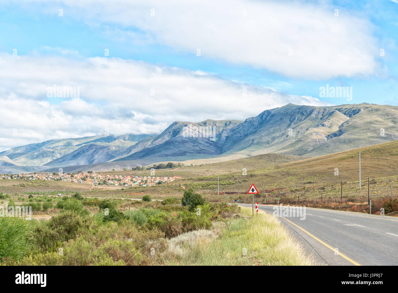 A view of the Riviersonderend Mountains with a township in Genadendal at its feet Stock Photo