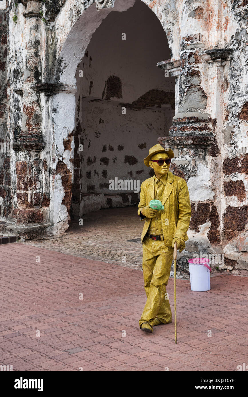 Street performer in front of the A Famosa Portuguese fortress, Malacca, Malaysia Stock Photo