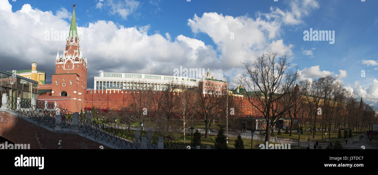 Moscow Kremlin Wall, Troitskaya Tower (Trinity Tower) and the Troitsky Bridge overlooking the Alexander Garden, one of the first urban public parks Stock Photo