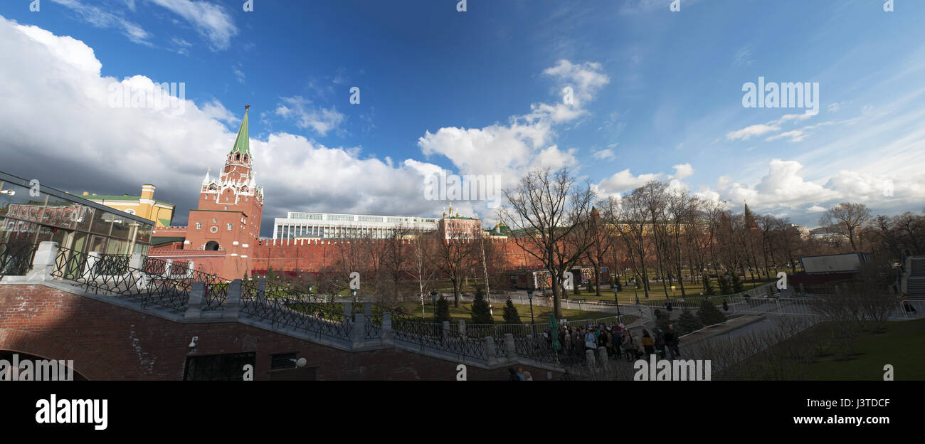 Moscow Kremlin Wall, Troitskaya Tower (Trinity Tower) and the Troitsky Bridge overlooking the Alexander Garden, one of the first urban public parks Stock Photo