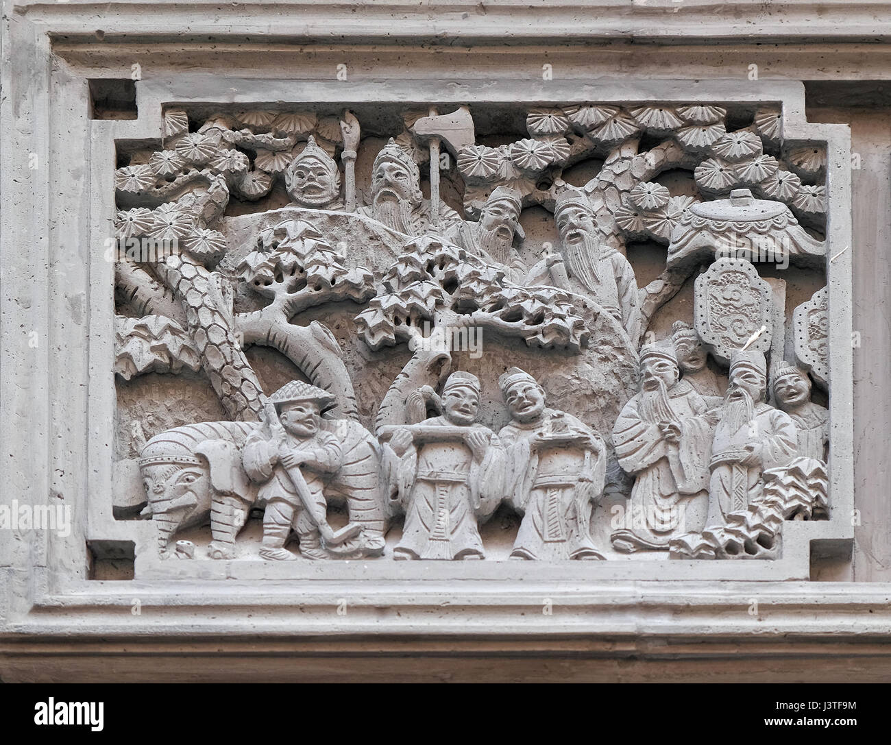 Richly carved stone bas-relief plaque on the doorway of the house in the Grand Canal, ancient town of Yuehe in Jiaxing, Zhejiang Province, China Stock Photo
