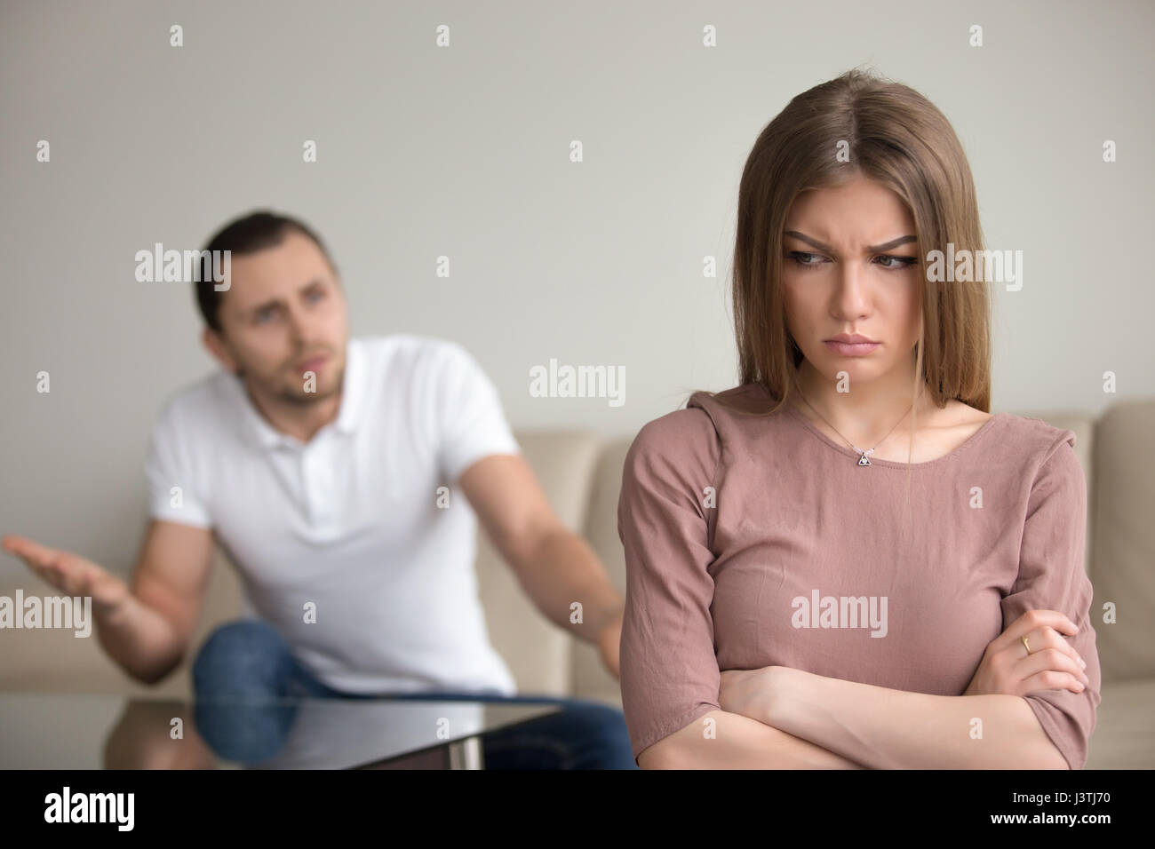 Angry husband mad at wife, unhappy woman frustrated, family conf Stock Photo