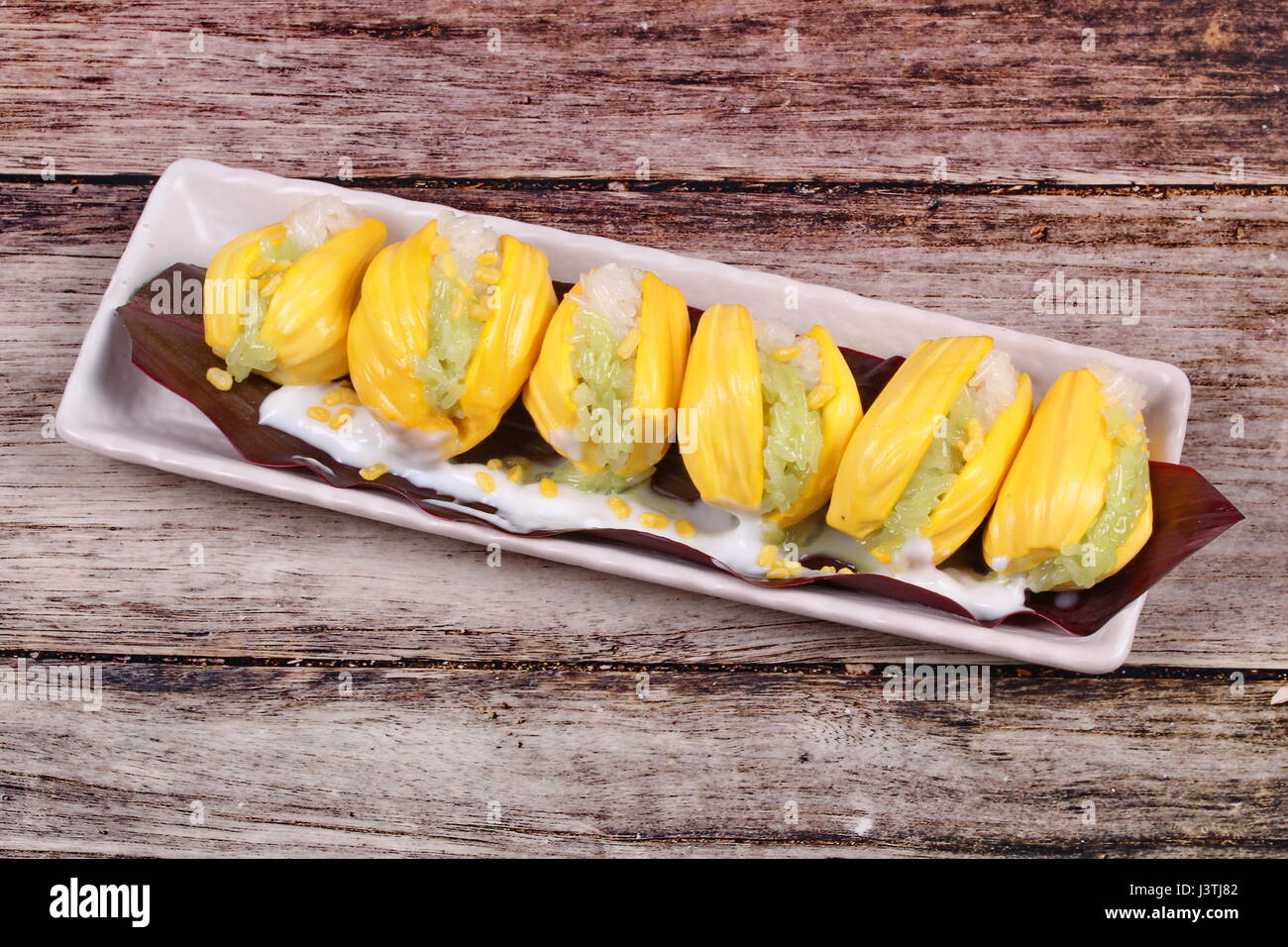 Thai dessert ,Jackfruit wrap the green and white of sticky rice in