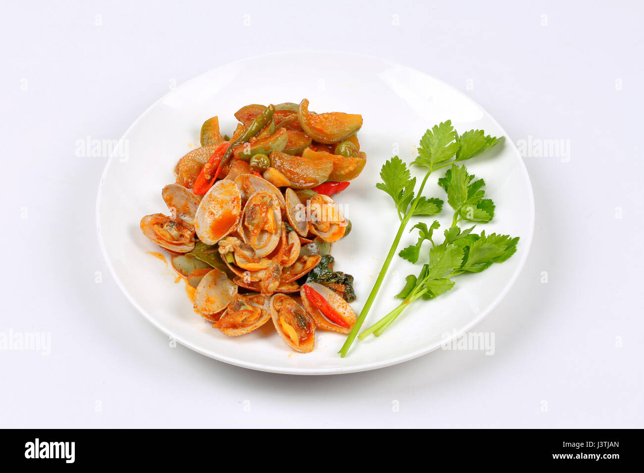 Thai recipe , Stir fried clams and eggplant with roasted chile paste call Hoi Lai  Pad Prik Phao. Stock Photo