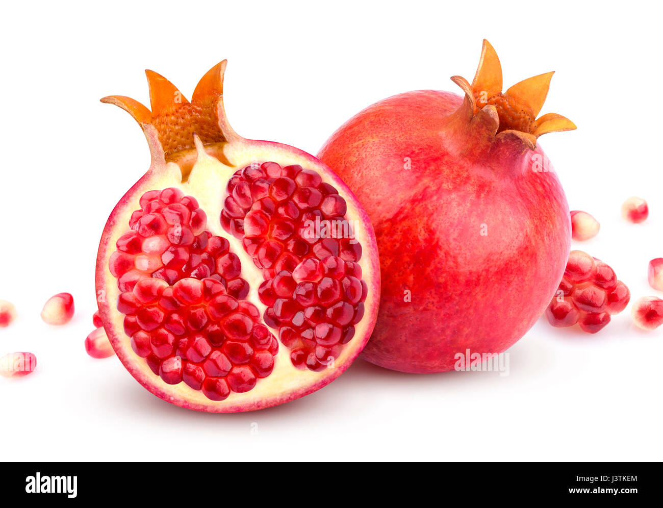 Pomegranate isolated. Whole pomegranate and its half isolated on white background Stock Photo