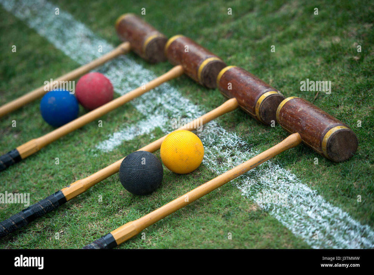 Croquet set laid out ready to play, croquet mallets and balls.Jayne Russell / Alamy Stock Photo Stock Photo