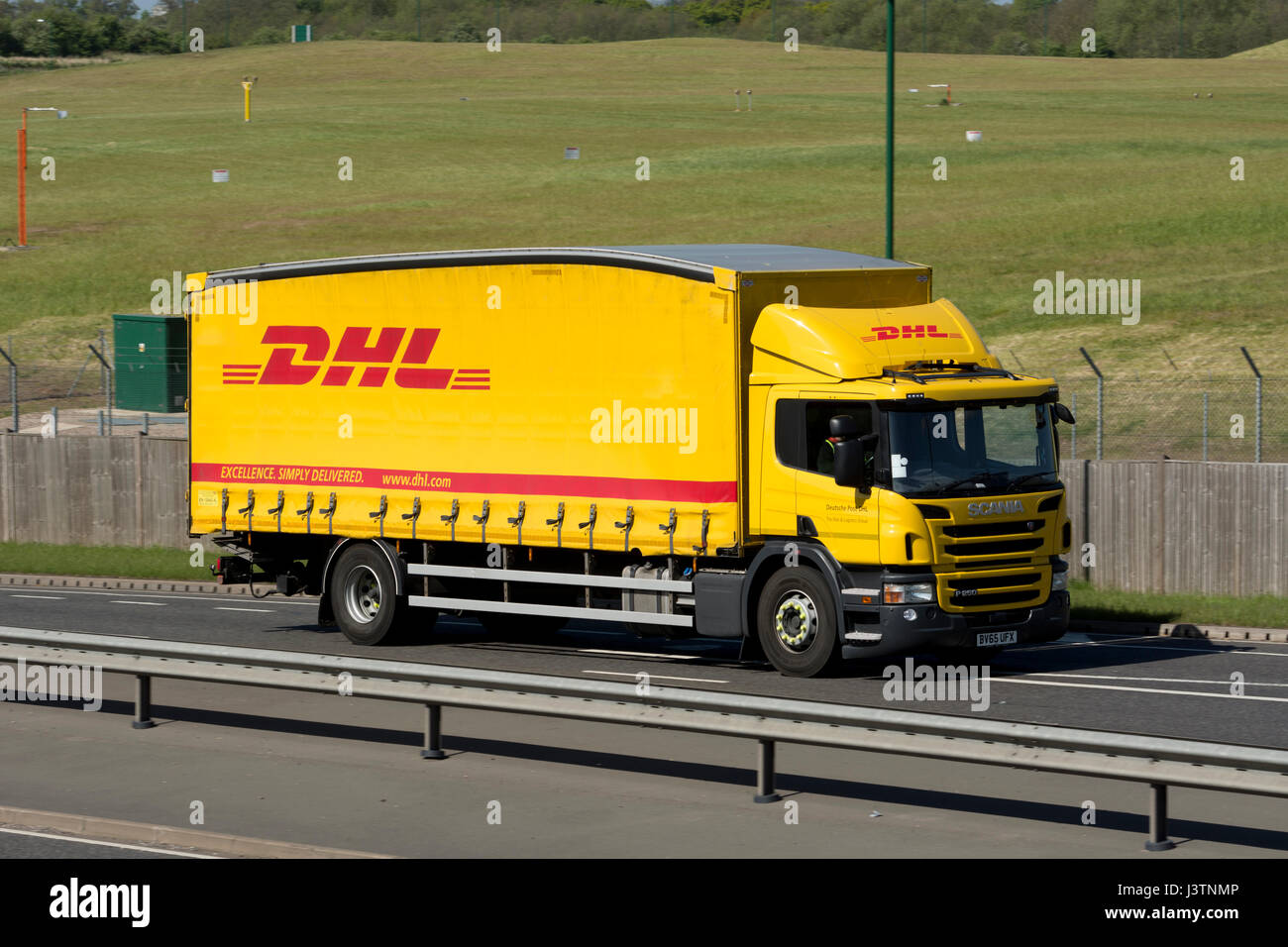 DHL lorry on the A45 road, West Midlands, UK Stock Photo