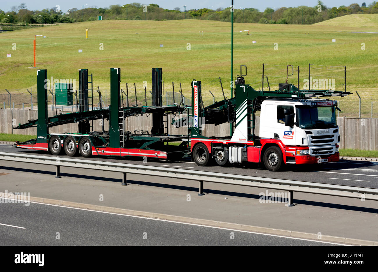 An empty BCA Automotive car transporter on the A45 road, West Midlands, England, UK Stock Photo