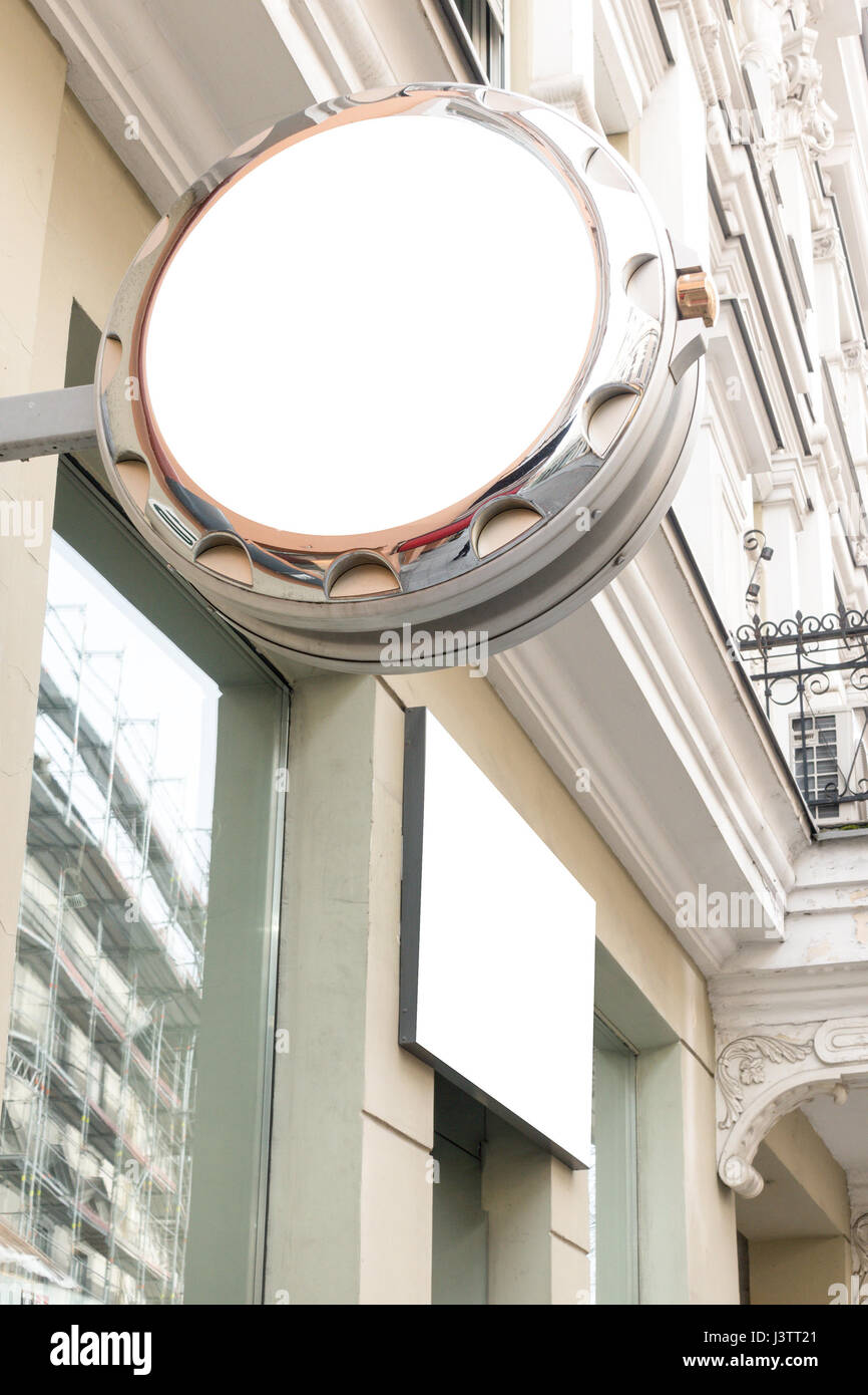 Mock up. Empty round signboard of watch store in classical architecture ...