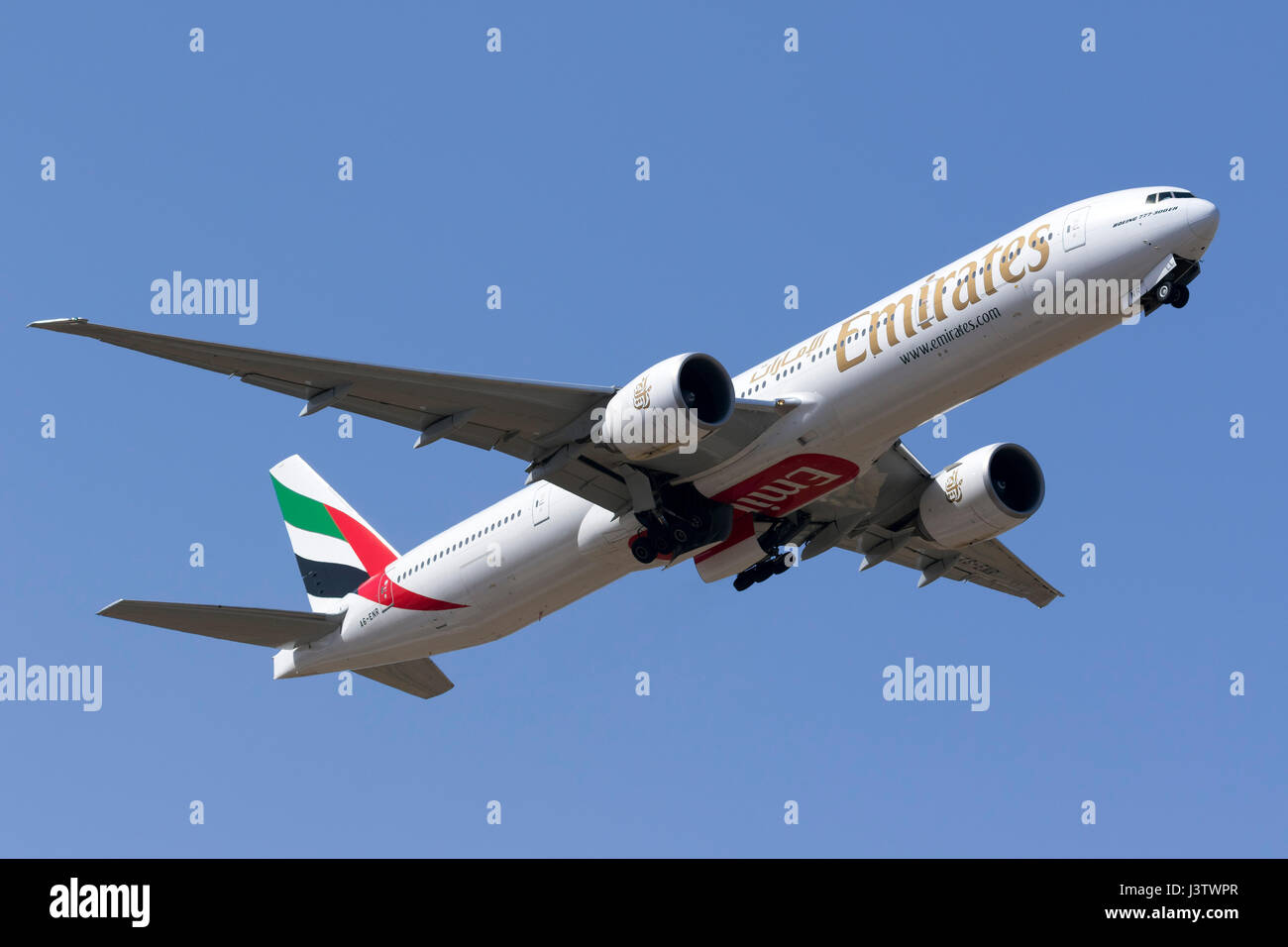 Emirates Boeing 777-31H/ER [A6-ENR] departing runway 13. Stock Photo