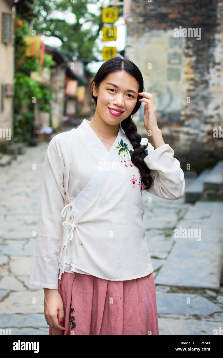 Girl wearing Han Chinese clothing in old town Stock Photo