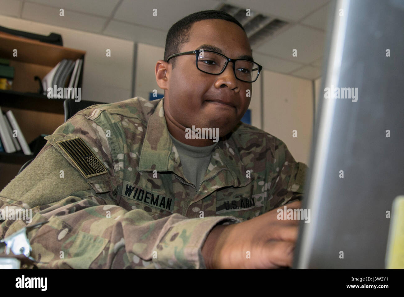 Spc. Kameron Wideman, a behavioral health technician assigned to the Brigade Support Medical Company, 215th Brigade Support Battalion, 3rd Armored Brigade Combat Team, 1st Cavalry Division, inputs patient information March 9, 2017 at the Behavioral Health Clinic at Camp Buehring, Kuwait. (U.S. Army photo by Staff Sgt. Leah R. Kilpatrick, 3rd Armored Brigade Combat Team Public Affairs Office, 1st Cavalry Division (released) Stock Photo