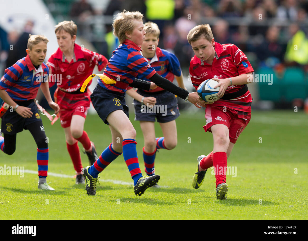 Teams of children playing tag rugby Stock Photo Alamy