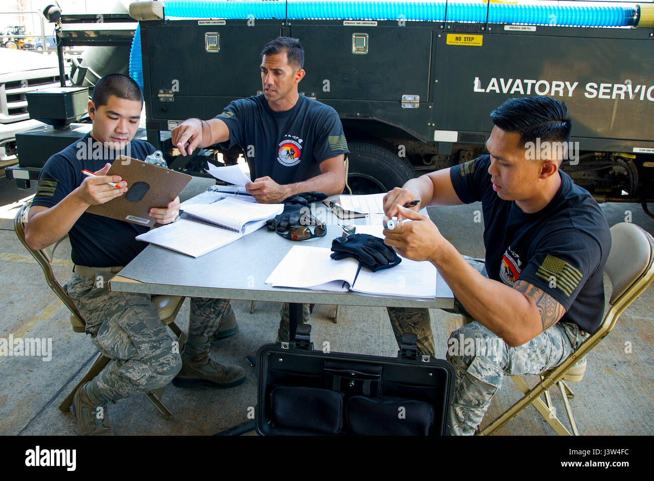 (L-R) Reserve Citizen Airmen Tech. Sgt. Marlon Gibo, Master Sgt. Alfred Van Gieson and Tech. Sgt. Dennis Dedicatoria inventory and inspect forms during the Port Dawg Challenge at Dobbins Air Reserve Base, Ga., April 25, 2017. The 48th Aerial Port Squadron was one of 23 teams competing in the 4th biennial Air Force Reserve Command's Port Dawg Challenge, which was designed to test and maintain the camaraderie of aerial port Airmen while promoting professionalism, leadership, training and communication between 'Port Dawgs.' The 48th APS, located on Joint Base Pearl Harbor-Hickam, Hawaii, is a com Stock Photo