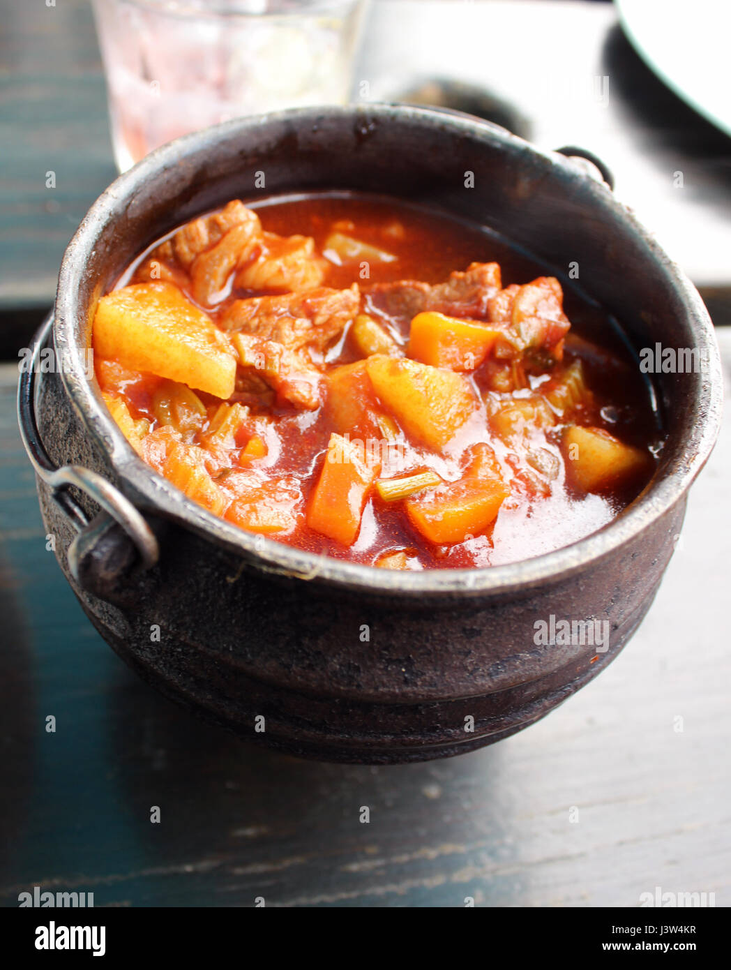 South African potjiekos stew in Iron pot Stock Photo
