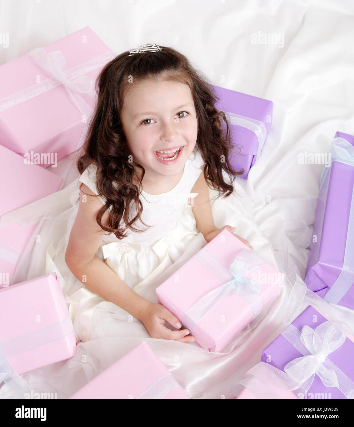 Little girl holding a present Stock Photo - Alamy