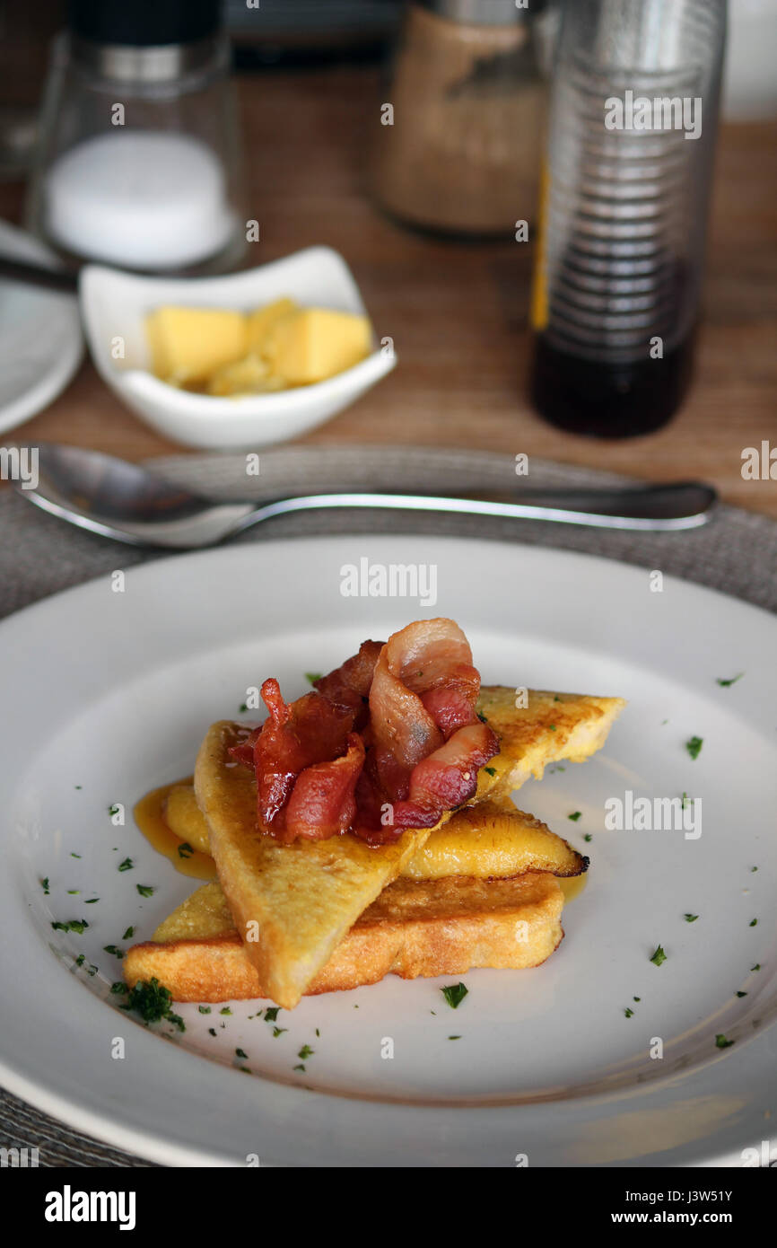 French toast with bannana, bacon and syrup Stock Photo Alamy