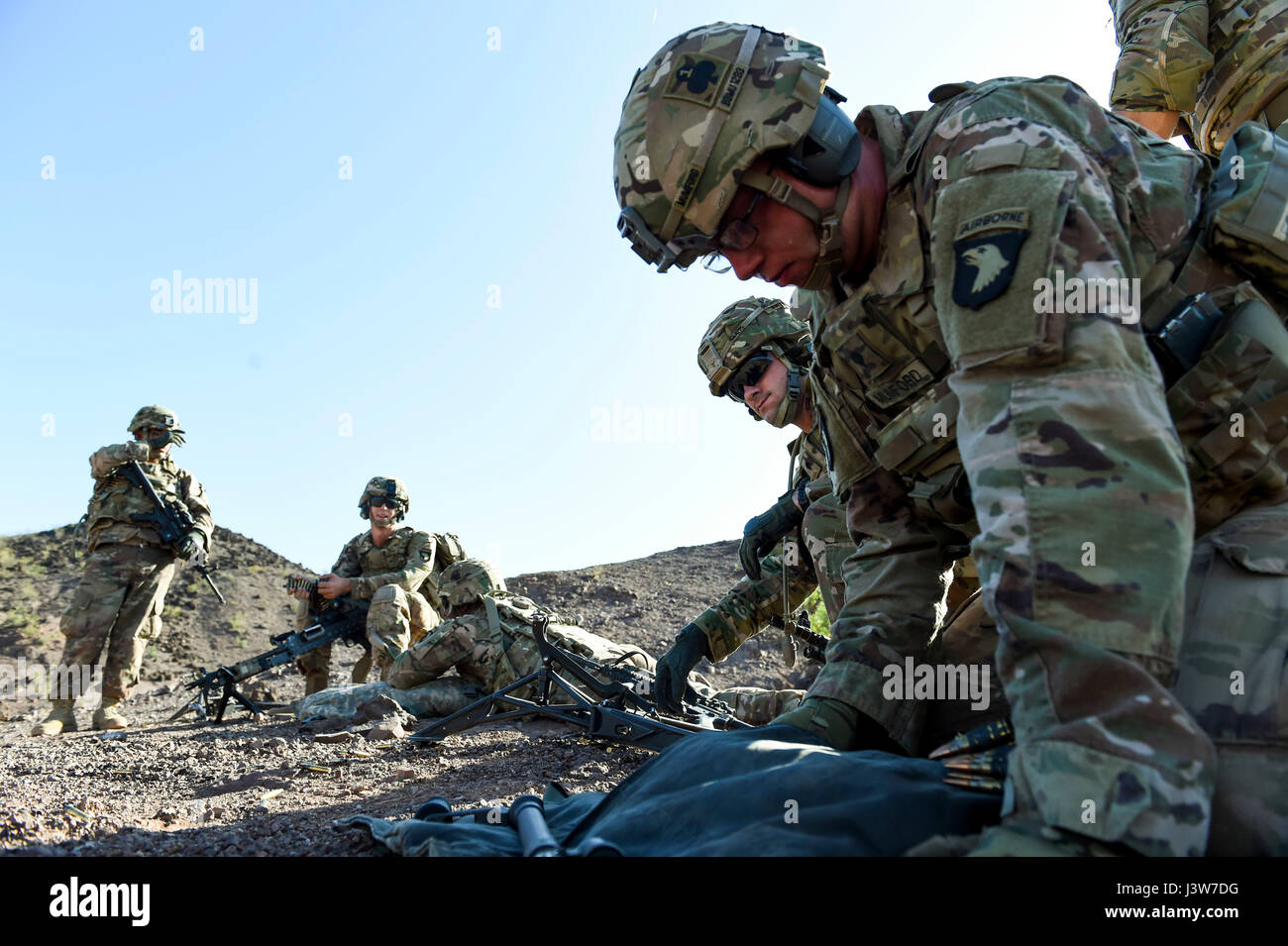 U.S. Army soldiers from the 101st Airborne Division set up an M240B ...