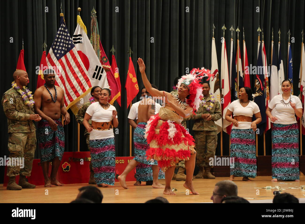 'Bullet Nation' soldiers perform a traditional Samoan dance during the Asian American Pacific Islander Heritage Month observance in Camp Carroll, South Korea, May 4, 2017. The demonstrations showcased the rich cultural heritage that is a part of the lives of our strong and diverse military. (U.S. Army photo by Cpl. Sin, Jae Hyung, 19th ESC Public Affairs) 170504-A-SY896-179 Stock Photo