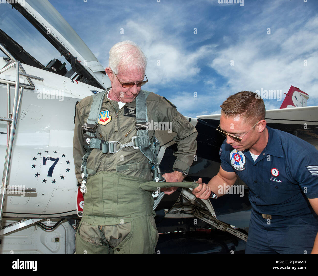 Former airline pilot Chesley “Sully” Sullenberger III puts on his G-suit before his flight with the United States Air Force Thunderbirds at Travis Air Force Base, Calif., May 4, 2017. Sullenberger is a 1973 Air Force Academy graduate and is best known for successfully landing a crippled airliner in the Hudson River saving the lives of a 155 passengers. (U.S. Air Force photo by Louis Briscese) Stock Photo
