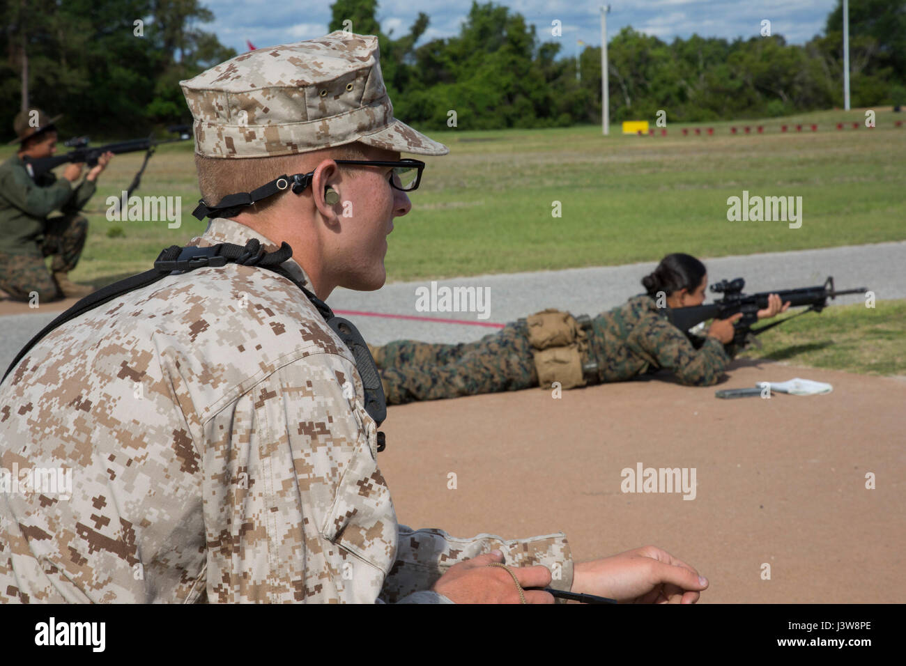 U.S. Marine Corps Rct. Andre Salomon, platoon 2041, Company G., 2nd  Battalion, Recruit Training Regiment, observes targets during  qualifications at the rifle range on Marine Corps Recruit Depot, Parris  Island, S.C., May