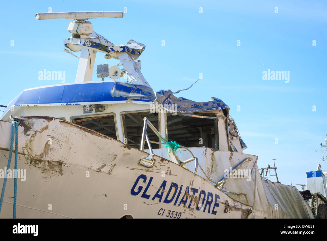 Chioggia, Italy - April 30, 2016: The wreck of the 'Gladiator' ship, sunk after crashing on the rocks in 2007, moored in a canal in Chioggia, Italy Stock Photo