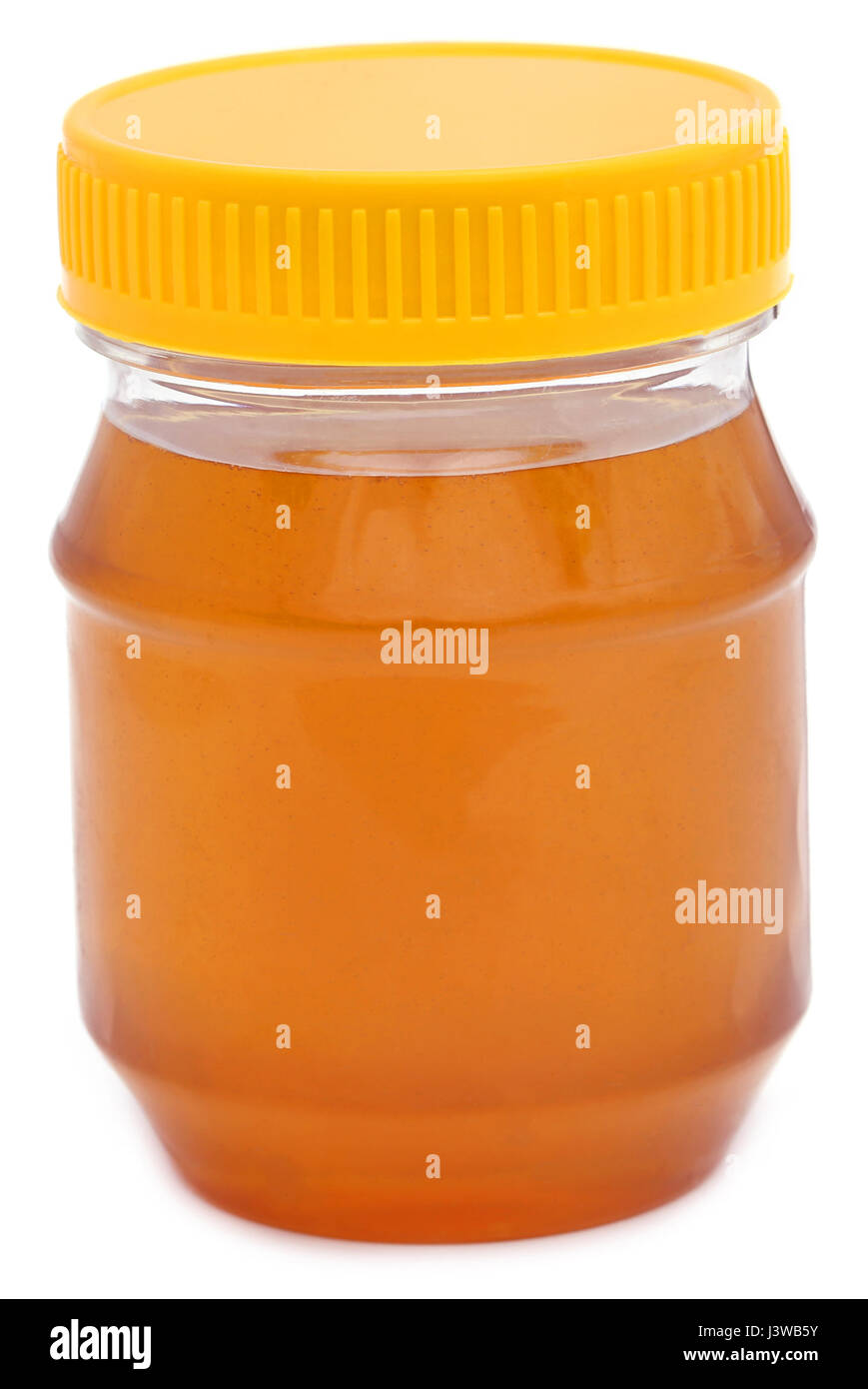 Honey in a jar over white background Stock Photo - Alamy