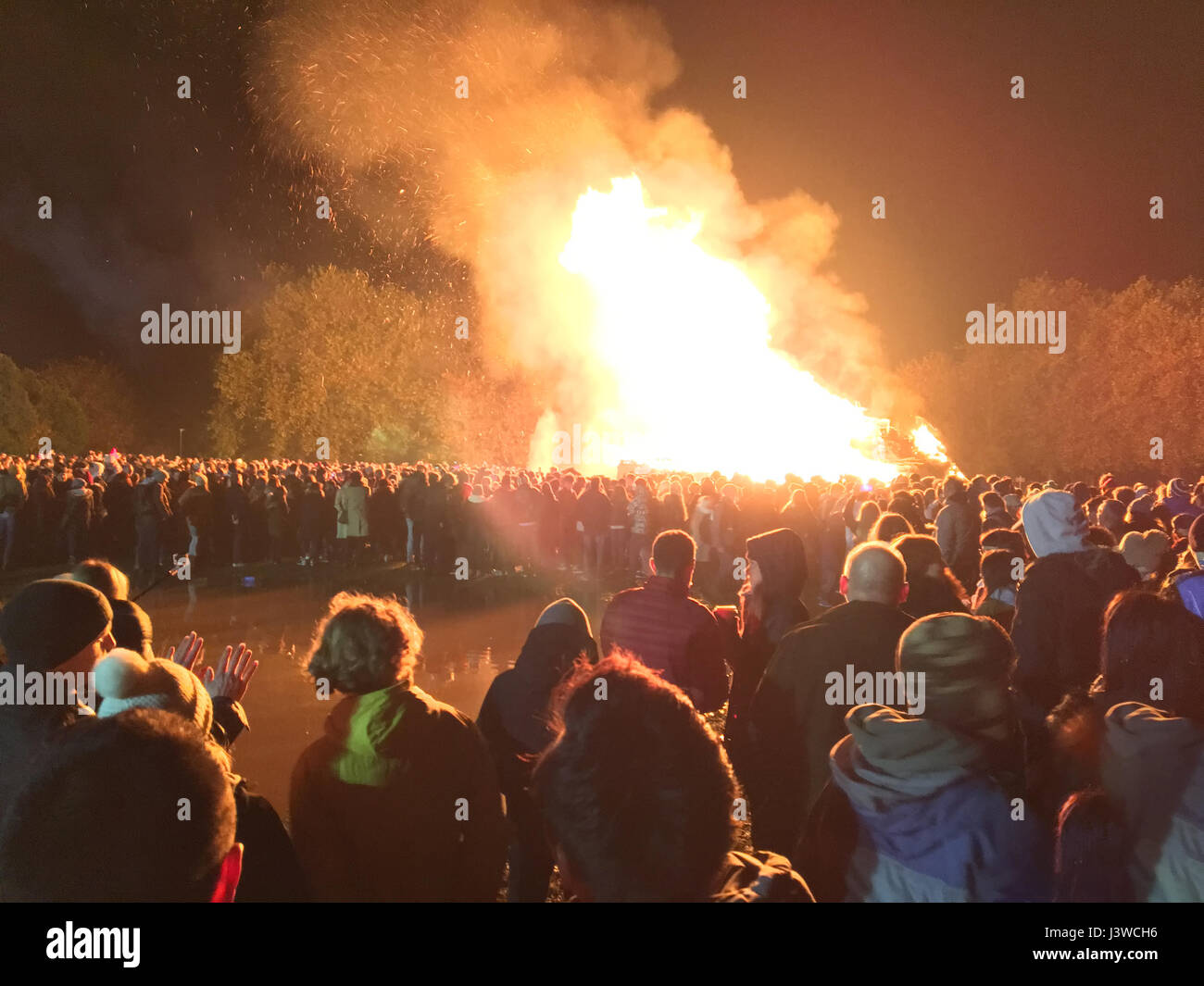 Lewes, England - 5 November 2016: Crowd gathering around the great bonfire of the yearly celebration of the Bonfire night festivities. Stock Photo