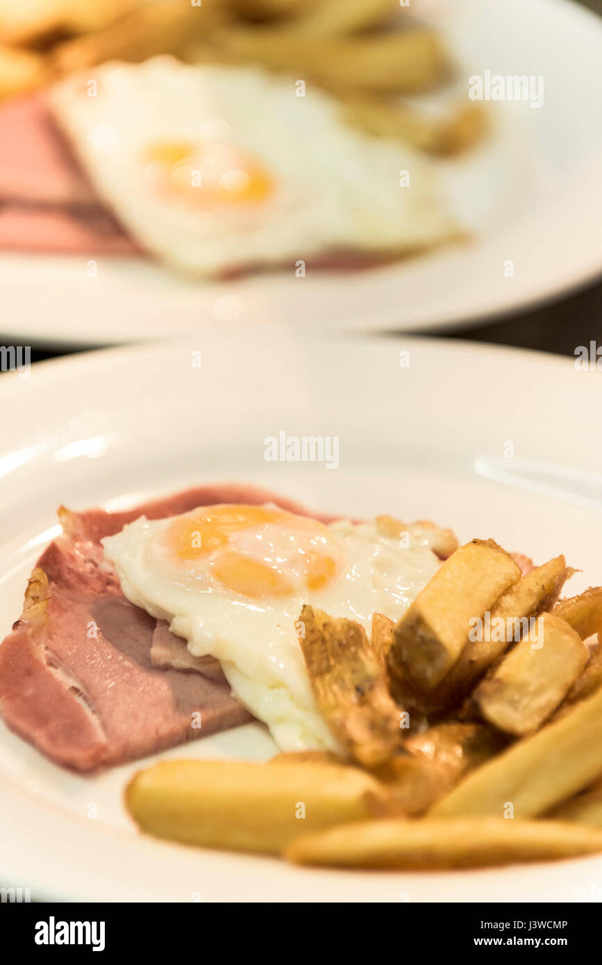 Food prepared by a chef Meal Kitchen Food preparation Restaurant food industry Cooked Ham Egg Chips Fries Stock Photo
