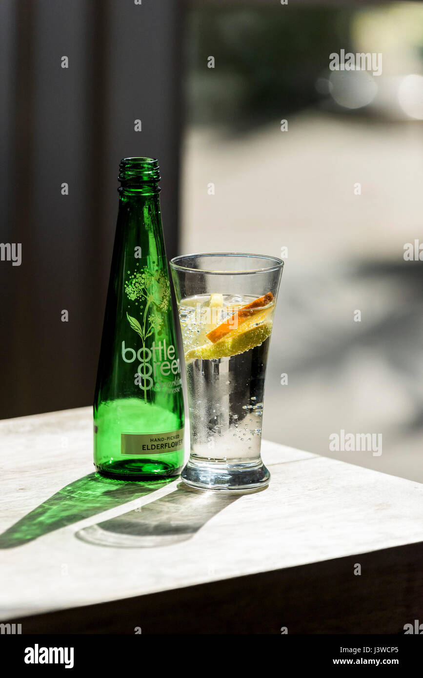 Bottle Green sparkling water Elderflower Brands Logo Refreshing drink Glass Summer drink Refreshment Stock Photo